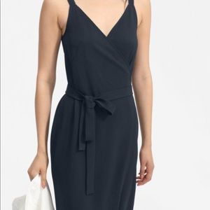 BLACK MIDI WRAP DRESS by EVERLANE, in drape wrinkle free fabric